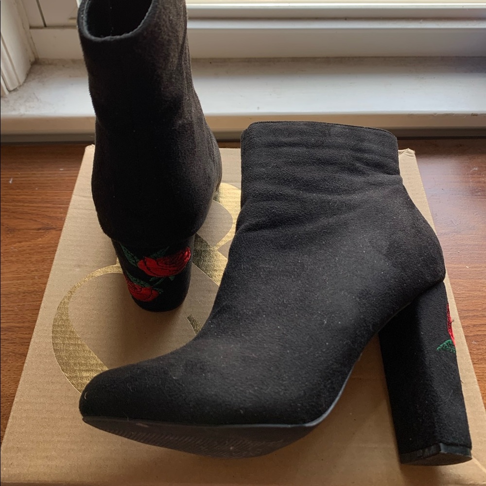 Black suede ankle booties with floral heel